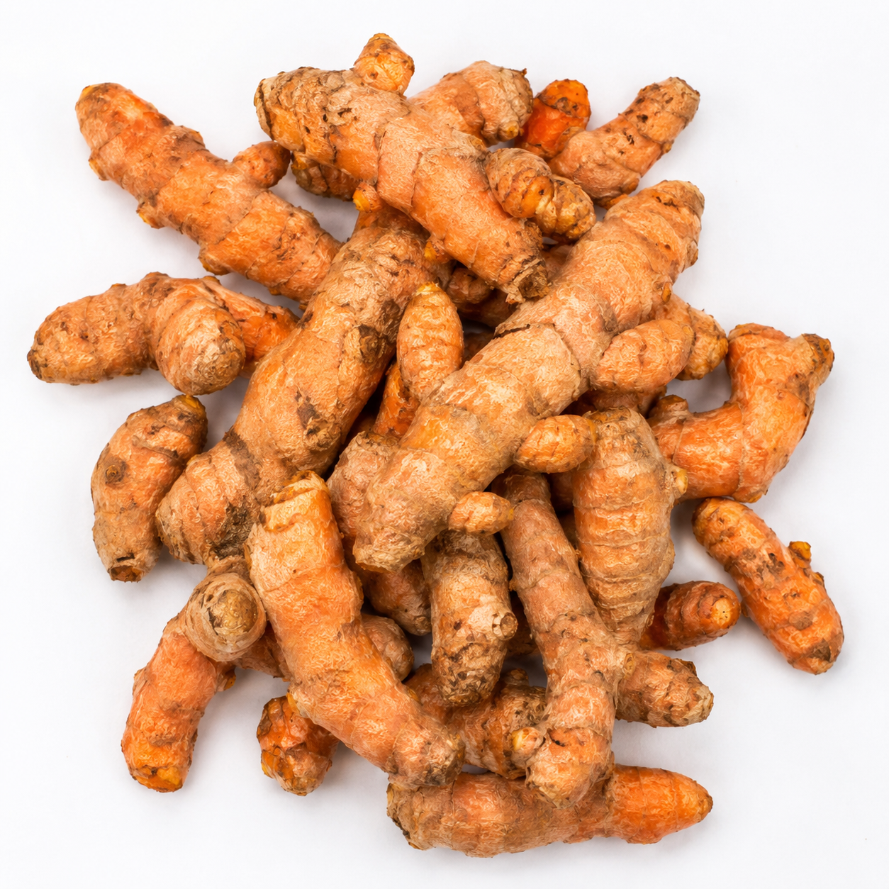Freshly Harvested Organic Turmeric Roots Top view of freshly harvested organic turmeric roots displaying their natural shape, earthy skin, and farm-fresh quality.