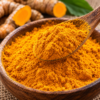 Fine Texture of Organic Turmeric Powder Close-up view of organic turmeric powder highlighting its fine texture, rich golden color, and premium-quality consistency.