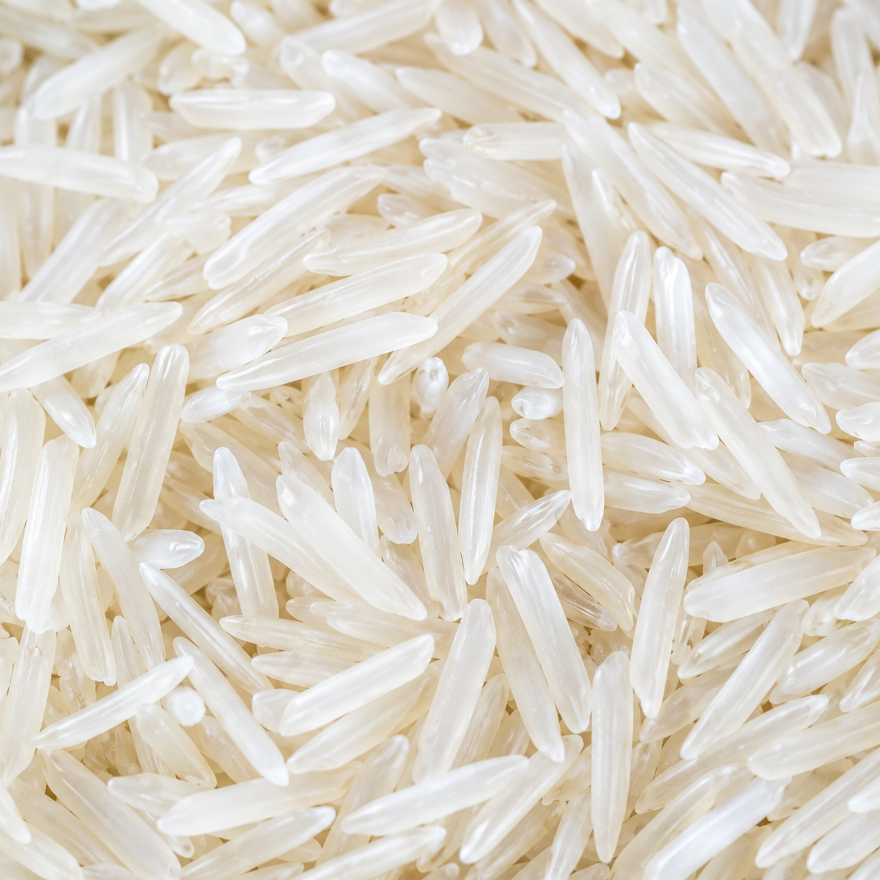 Natural Texture of Premium Raw Basmati Rice Macro Close-Up of Premium Raw Basmati Rice Grains Showing Fine Natural Texture